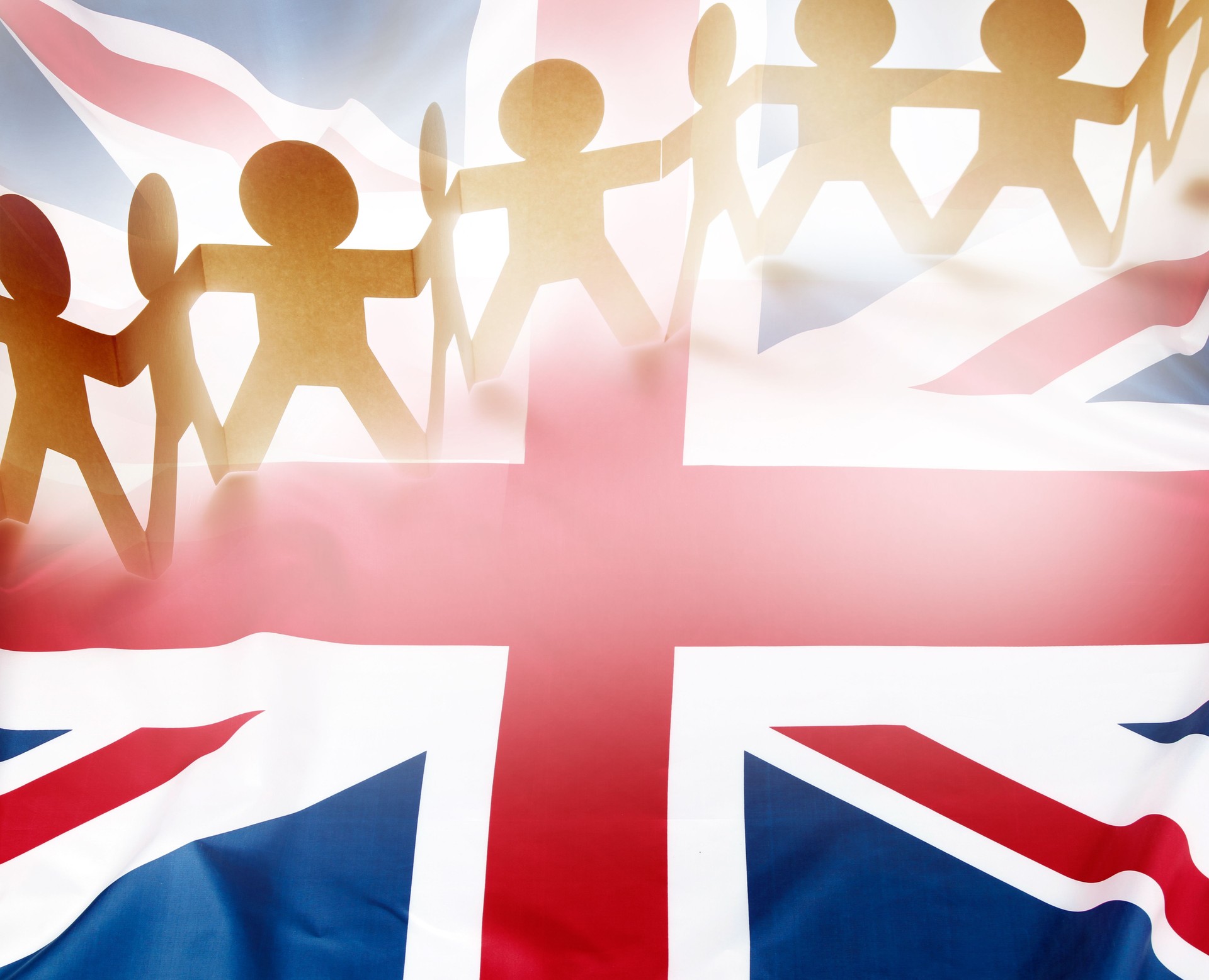 Team holding hands united on UK flag